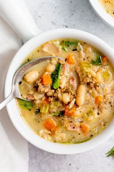 a white bowl filled with soup on top of a table