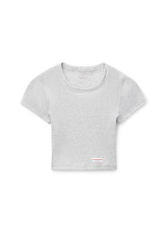 Semi-sheer cropped short sleeve crewneck tee with logo flag tag at left waist in light heather grey ribbed cotton. Form fitting. Bottom hem hits above high waist. Composition: 100% cotton. Made in china. Model is 5'11" and wears a size S. 8CC2238046050. Flag Tag, Alexander Wang, Women Crop, Heather Grey, Short Sleeve Tee, Alexander, High Waist, Composition, Flag