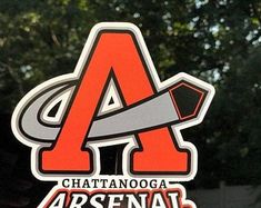 an orange and gray sticker on the side of a car that says chatanooga arsenab