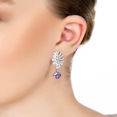 A breath-taking fusion of nature's elegance and exquisite craftsmanship. Handcrafted from luxurious 925 sterling silver, these earrings are more than just accessories; they are a statement of refined taste and timeless beauty. The design draws inspiration from Mother Nature herself, featuring a delicate leaf motif adorned with sparkling zircons. On one side, you'll find meticulously pave-set zircons, while the other side dazzles with marquis-cut stones. Suspended beneath this elegant leaf is a s Elegant Amethyst Dangle Earrings, Elegant Amethyst Earrings, Luxury Purple Sterling Silver Earrings, Lavender Fine Jewelry Earrings For Formal Occasions, Formal Lavender Fine Jewelry Earrings, Elegant Amethyst Drop Earrings, Elegant Lavender Sterling Silver Earrings, Elegant Lavender Drop Earrings, Luxury Silver Amethyst Earrings