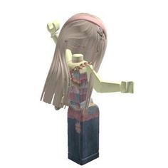 a doll with long blonde hair standing on top of a block