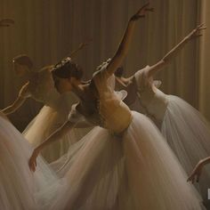 several ballerinas in white tulle skirts are dancing