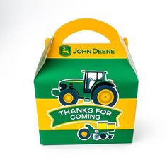 a green and yellow box with a tractor on the side that says thanks for coming john deere