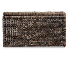 a brown woven storage box with lid and handles on the bottom, in front of a white background