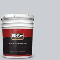 a bucket of behr paint on a blue background