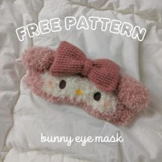 a hello kitty sleeping on top of a bed with the caption free pattern bunny eye mask