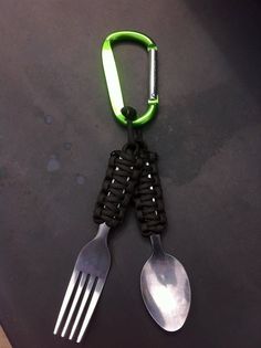 two spoons and a fork are attached to a lanyard