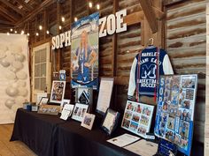 a table topped with pictures and framed photos