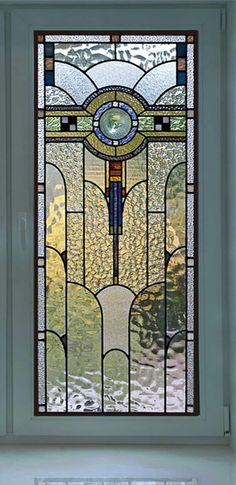 a stained glass window with a cross on it