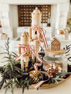 a tray filled with christmas decorations and candles