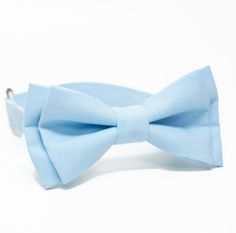 This little boys bowtie is so adorable and cute! Your little guy will look his very best!  The perfect bow tie for your little one. Wear this bowtie to church, a wedding, for a birthday, as a photo prop or just to dress up your little guy.  The shown bow tie measres 1 1/2" x 3 3/4". (spot clean only) * choose the attachment: please note months or ages.  - Clip on - Adjustable strap  : Neck-strap is adjustable with slider for easy on and off. Fit for all size neck.  More Sizes Available - Please Blue Bow With Bow Tie Back For Wedding, Blue Bow Tie With Bow Tie Back For Weddings, Blue Bow Tie For Wedding, Blue Wedding Bow Tie With Bow Tie Back, Blue Bow Tie With Bow Tie Back For Groom, Dapper Blue Bow Tie For Groom, Classic Blue Bow Tie For Wedding, Blue Bow Tie For Wedding And Father's Day, Classic Blue Bow Tie For Groom