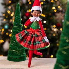 NEW for 2024Have your elf dressed in her best this holiday season! This cutie features a green top decorated with golden flecks and a plaid skirt with green tulle underneath! This is the perfect outfit for the Christmas parties you'll attend! Elf not included. Made by Elf On The Shelf. Item #: CCPLAIDDR Party Dress Outfit, Elf Dress, Glamour Party, Elf Clothes, Green Tulle, Elf Ideas, Christmas Parties, Green Top, Plaid Skirt