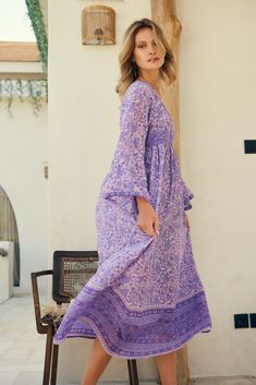 The Jade Printed Maxi Dress in Lavender is a must-have for any beach-to-bar occasion. Its sophisticated and graceful design sets it apart from other maxi dresses, making it an instant classic from Blue Boheme. Made from 100% Indian cotton with a lining, this dress is both comfortable and stylish. It comes in two sizes, Small/Medium (fits sizes 2-6) and Medium/Large (fits sizes 6-10), ensuring a perfect fit for every body type. The beautiful lavender color adds a touch of femininity to the dress, Purple Beach Dress For Spring, Purple Spring Beach Dress, Spring Beach Dress, Floor-length And Flowy, Purple Long Dress Beach Cover-up, Purple Summer Maxi Dress For Vacation, Summer Flowy Purple Midi Dress, Summer Vacation Purple Maxi Dress, Spring Lavender Bohemian Maxi Dress, Purple Flowy Maxi Dress For Beachwear