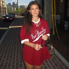 Get ready to make a statement with the Mara Letter Print Oversize T-Shirt! This bold red shirt features a unique aesthetic letter print that adds a touch of whimsy to any outfit. The short sleeves and loose fit make it perfect for all-day comfort, while the contrast colors add an extra pop of fun. Part of the Alees Fashion Streetwear Collection. Details Mara Letter Print Oversize T-Shirt in Red Short sleeve Contrast colors Aesthetic letter print Loose fit Alees Fashion Streetwear Collection Trendy Red T-shirt For Summer, Retro Red Tops For College, Red Graphic Print Tops For College, Red Slogan Top For Summer, Casual Red Slogan Top, Retro Red Tops With Slogan, Red Graphic Tee For College, Trendy Red Slogan Top, Red Retro Tops For College