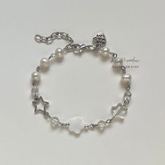 "Handmade Dreamy Pearl Bracelet ✿ Made with freshwater pearls, glass crystal beads,  glass beads, natural shell, and metal accents ✿ Colors: Silver, milky white, iridescent clear, and pearlescent white ✿ The bracelet has an additional 1-1.5\" of extension chain" Chain Bracelet With Beads, Diy Silver Bracelets, How To Make Chain Bracelets, White Metal Pearl Bracelet With Round Beads, Silver Pearl Charm Crystal Bracelet, Silver Crystal Bracelet With Pearl Charm, Handmade Pearl Crystal Bracelet In Silver, White Pearl Charm Bracelets For Jewelry Making, Handmade Silver Pearl Crystal Bracelet