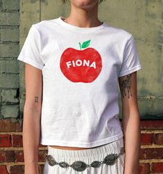 🍎 Fiona Red Apple Baby Tee 🍎 Red Apple Fiona Baby Tee | Fiona Fan Merch Shirt Music Lover Gift Graphic Baby Tee Y2K Downtown Girl 00s Pinterest Aesthetic Top Inspired Concert Fan Merch Retro Y2K Aesthetic Trendy Summer Gift for friends Womens Fitted Shirt | Vintage Fiona Apple Inspired Coquette Shirt | 00s Women's T-Shirt | Y2K Retro Style | Aesthetic Top | Womens Bday Gift | Cute 2000s Tshirt | Y2K Baby Shirt | Birthday Gift for Friends, Girlfriends, Partner | Print tshirt | Boho style | Y2K Y2k Style Tops For School, Cute Fitted T-shirt For School, Y2k Cotton Tops For School, Downtown Girl Music, Y2k Downtown, Coquette Shirt, Merch Shirt, Fiona Apple, Bday Gift