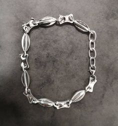 Men's Must-Have Chain Bracelet, Hand Forged Silver Chain, Oxidized Bracelet, Raw Unisex Link Bracelet, Black Chain, Unique Gift For Him. Gift For Him The perfect gift for him, a Men's Hand Forged Chain Bracelet, Artisan Solid Sterling Silver, each motif is made and placed by hand oxidized and polished. A unique, statement chain bracelet, easy to wear for both men and women. Link bracelet with two different motifs that combined create a delicate, elegant, and together brutal and dark fantastic pi Metal Chain Bracelet With Hook And Links For Gift, Sterling Silver Bracelet With Oval Links, Luxury Metal Chain Bracelet With Oyster Style, Silver Bracelets With Hook And Links For Formal Occasions, Luxury Metal Chain Bracelet With Oyster Design, Sterling Silver Formal Bracelet With Hook And Links, Elegant Metal Chain Bracelet With Hooks And Links, Sterling Silver Chain Bracelet With Intricate Design, Formal Silver Chain Metal Bracelet