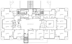 the floor plan for an office building with multiple floors and staircases, including two levels