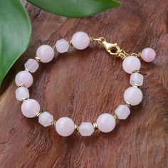 Showcasing faceted and round beads of pale pink rose quartz, this bracelet exudes feminine appeal. Tipa in Thailand designs the bracelet, which features flat beads of golden hematite and a gold-plated sterling silver clasp and extender chain. Gemstone Accessories, Rose Quartz Bracelet Beads, Jewellery Craft, Flat Beads, Jewerly Beads, Rose Quartz Bracelet, Beads Bracelet Design, Doll Jewelry, Simple Bracelets