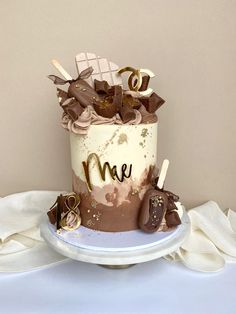 there is a cake with chocolate and marshmallows on the top that says me