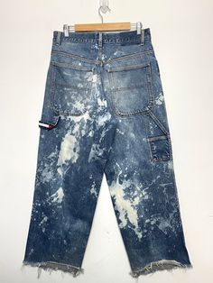 These jeans have been previously bleach dyed while the cuffs have also been removed. They show slight distressing around the knees. (See photos for flaws) Measurements  Pit to pit (width): 33 inches Top to bottom (length): 29 inches Faded Pre-washed Bottoms For Streetwear, Acid Wash Bleached Relaxed Fit Jeans, Acid Wash Relaxed Fit Jeans, Relaxed Fit Acid Wash Hand Dyed Jeans, Distressed Washed Blue 90s Bottoms, 90s Distressed Washed Blue Bottoms, 90s Style Distressed Cotton Jeans, 90s Distressed Cotton Jeans, Faded Pre-washed Jeans For Streetwear