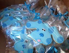 blue decorated cookies in plastic wrappers on display