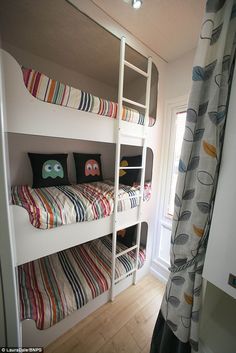 a bunk bed with two sets of pillows on it