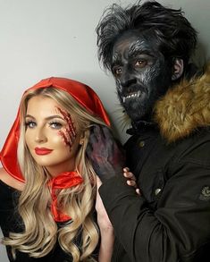 a man and woman dressed up as zombies