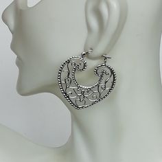 Indian style sterling silver filigree ear hoops. Dimensions: 31.5 x 33 mm weight: 5.8gm Price listed is for ONE PAIR These are made of 925 hypoallergenic sterling silver. Most of my pieces come with a 925 stamp. Can be packaged in a gift box. I can include a personal message from you if needed You are welcome to contact me at... bhavnakwintra1956@gmail.com For more beautiful pieces from my shop, please browse 👇 TOE RINGS: https://www.etsy.com/your/shops/TheSilverGame/tools/listings/section:2702 Silver Filigree Hoop Earrings For Festival, Ornate Silver Metal Hoop Earrings, Ornate Silver Hoop Earrings, Wanderlust Jewelry, Hoops Silver, Hoop Charms, Jewelry Heart, Sterling Silver Filigree, Skull Earrings