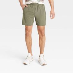 Men's Stretch Woven Shorts 7" - All In Motion™ Green L Casual Athletic Shorts With 5-inch Inseam For Sports, Casual Gym Shorts With 5-inch Inseam, Casual Athletic Shorts For Workout With 5-inch Inseam, Casual Short-length Activewear For Outdoor, Relaxed Fit Recycled Polyester Shorts With Elastic Waistband, Casual 5-inch Inseam Athletic Shorts For Sports, Casual Athletic Shorts With 5-inch Inseam For Workout, Casual Solid Color Recycled Polyester Shorts, Casual 5-inch Inseam Gym Shorts