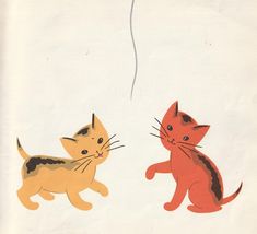 an image of two cats playing with a balloon