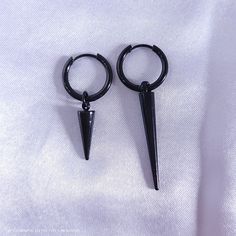 Long black spikes completely embody Jk's style and aura! Black earrings are harder to find, so I'm excited to add these ones to the list. Hoops are electroplated stainless steel, therefore hypoallergenic. They measure about 2 inches long, including the spike. All items come from a smoke free, kitty friendly home. ***Please note that monitor settings can differ, and colors may vary slightly!*** Black Gothic Jewelry With Spikes, Black Metal Emo Earrings, Black Metal Jewelry With Spikes, Black Metal Spiked Jewelry, Black Punk Metal Earrings, Nickel-free Black Punk Earrings, Black Nickel-free Punk Earrings, Edgy Black Earrings For Streetwear, Alternative Style Nickel-free Black Earrings