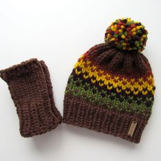 Fall Harvest Knit Hat and Fingerless Gloves Set  - Knit with yarn in fall colors: brown, orange, green, mustard - Wool/acrylic blend, soft, bulky yarn - Cozy and warm for fall - Slightly slouchy hat - should fit most (gloves are one size fits most) Knit by me in my smoke free (pug friendly) home. Knit Fair Isle, Fair Isle Hat, Knit Hats, Fall Gifts, Slouchy Hat, Bulky Yarn, Autumn Colors, Fall Collection, Pom Beanie