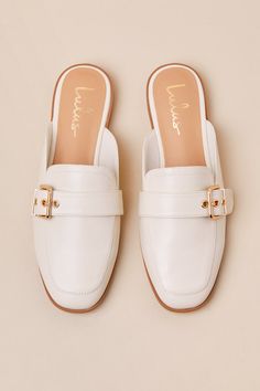 Upgrade your everyday flats with a chic new option like the Lulus Marquete Bone Buckle Mule Slides! These too-cute mules have a smooth, faux leather construction that shapes an almond toe upper and an adjustable strap with a gold buckle and matching grommets. Classic notched collar leads to a slide-on design for effortless styling. 0. 75" rubber heel. Cushioned insole. Rubber sole has nonskid markings. Man made materials. Imported. Lulus | Marquete Bone Buckle Mule Slides | Size 10. Spring Faux Leather Closed Toe Slip-ons, Spring Closed-toe Faux Leather Slip-ons, Beige Faux Leather Flats For Spring, Elegant Beige Flat Mules, Spring Beige Faux Leather Flats, Spring Season Beige Faux Leather Flats, Chic Beige Flat Mules, Spring Flat Faux Leather Slip-ons, Elegant Cream Slip-ons