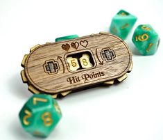 a wooden board game with dices and numbers on the side, including two hearts