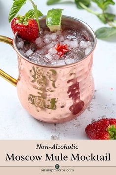 a moscow mule cocktail in a copper mug with ice and strawberries on the rim