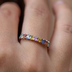 A stacking rainbow sapphire ring in 14K solid white gold in prong setting. A multicolor half eternity wedding band for women. The best anniversary gift for her! 100% handcrafted with love! PRODUCT DETAILS * Metal: 14K solid gold, 14K white gold or 14K rose gold * Gemstone: 9 Sapphires, princess cut * Sapphires' Weight: 1.11ct total RING SIZING For General Reference: * we use standard US Ring Sizing * an average women's ring finger is size 6 * if your ring size is not listed please contact us HOW Best Anniversary Gifts, Gold Amethyst Ring, Sapphire Wedding Rings, Sapphire Wedding Band, Rainbow Sapphires, Rainbow Rings, Half Eternity Wedding Band, Sapphire Band, Multi Sapphire