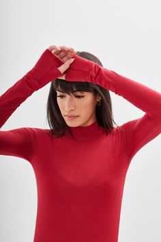 Peak "minimalism with an edge" at your service. Handcrafted from our beloved sheer European jersey, Stef is a relaxed-fit tunic featuring a turtleneck and long sleeves complete with cuffs and thumbhole. Her asymmetric hem gives an added level of flowing sophistication with day to night versatility: layer her over leggings for an effortless athleisure look, or pair her with wide-leg pants for maximum drama. | Sam, in red is 5'8" (173 cm) tall, wearing size XS. Natalee, in anthracite, is 5'10" (17 Effortless Athleisure, Fitted Tunic, Sweatshirt Fabric, Long Sleeve Turtleneck, The A Team, Asymmetric Hem, French Terry, Leg Pants, Athleisure