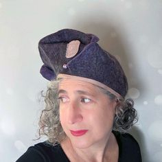 This Sculptural, Purple Exclamation Mark Beret is certainly a quiet Statement Hat. It's a jewel-toned and elegant hat to wear to a wedding or celebration. Or perhaps just wear it to town! It is wearable art that can be worn in various ways, with the exclamation point on the front or side. Turn the hat to whichever way suits you best. COLORS: The colors of this beret range in purple: from lavender to dark, plummy brown. The hat is made from soft Merino wool and has some grey Gotland-type wool, gi Elegant Flat Cap, One Size Fits Most, Elegant One-size Flat Cap, Elegant One Size Fits Most Flat Cap, Adjustable Brimmed Elegant Beret, Elegant Handmade Hat, One Size Fits Most, Elegant Handmade Hats One Size Fits Most, Elegant Hat, Statement Hat, Exclamation Mark