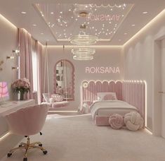 a bedroom decorated in pink and white with chandelier, bed, chair, desk and mirror