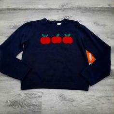 * New, With Tags * 100% Cotton * Navy Blue With Apples Across Front * 2 Small Buttons On Back * Same Or Next Day Shipping Vegetable Sweater, Apple Sweater, Sweater Design, On Back, Colorful Sweaters, Kids Shirts, Apples, Sweater Top, Shirts Tops