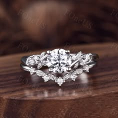 a diamond ring on top of a wooden table