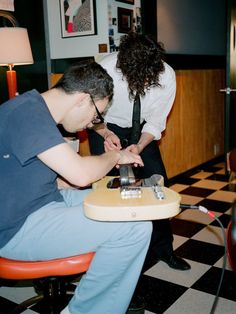 two people sitting at a table in a restaurant