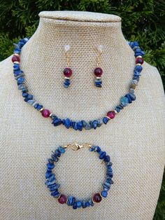 Treat your loved ones or yourself with one of a kind piece of jewelry. This custom made gorgeous genuine gemstone set will indulge anyone and be noticible. Made with care and love. item Details Natural high quality lapis lazuli raw chips, combined with 8 mm magenta colour tiger's eye round brads, set in 18k gold filled jewellery findings. Necklace 16". Bracelet 7.25" length.  Earrings 1.25". 18k gold plated over sterling silver hooks. Length options are available, just send a message.  Materials Adjustable Natural Stones Necklace For Her, Adjustable Natural Stone Necklaces For Her, Adjustable Natural Stone Necklaces As Gift For Her, Spiritual Gemstone Jewelry Sets For Gifts, Spiritual Stone Jewelry For Gifts, Handmade Bohemian Jewelry Gift For Mom, Gemstone Round Beads Jewelry Gift For Her, Natural Stones Jewelry With Round Beads For Her, Adjustable Gemstone Beads Jewelry Sets As Gift