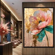 a large flower painting hanging on the wall next to a vase with flowers in it