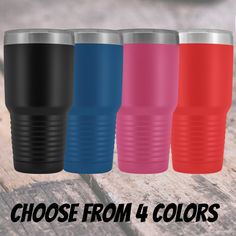 three different colored tumblers sitting on top of a wooden table with the words choose from 4 colors