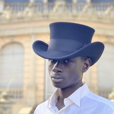 Western top hat with large brim. Victorian top hat.You can make your hat with your favorite color by choosing it from my Wool felt color card. Made with high crown and embellished with a 50 millimeters wide grosgrain ribbon. Edwardian top hat ideal for everyday and special ocasions such as weddings, cocktails or parties. For man and woman.Measurements in centimeters are 36 x 28. Crown height 12. Brim length 9. These measurements may have some slight variation depending on the size of the hat.The Cowboy Top, Hat Business, Victorian Top, Whimsical Goth, Western Top, Black Top Hat, Crown Heights, Western Tops, Top Hats