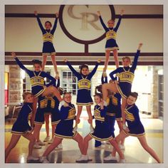 a group of cheerleaders are posing for a photo