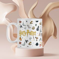 a harry potter coffee mug surrounded by other items