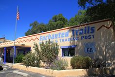 the entrance to an enchanted trails post office